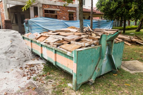 Construction site with builders waste ready for clearance in Oxted